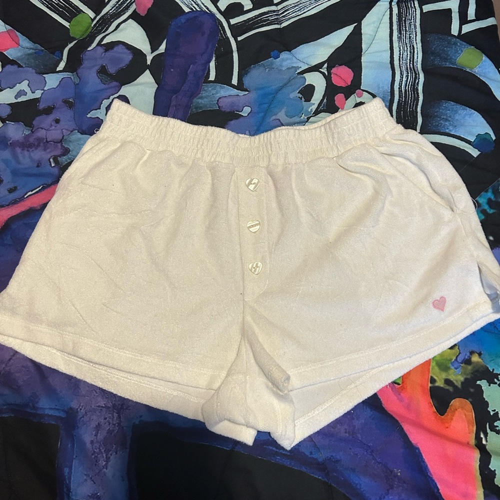 cute beach shorts with heart buttons.